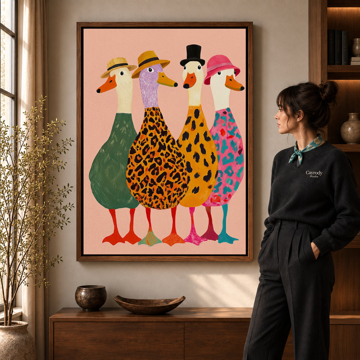 Fashionable goose flock canvas art in a walnut frame beside a standing woman in a warm living room.