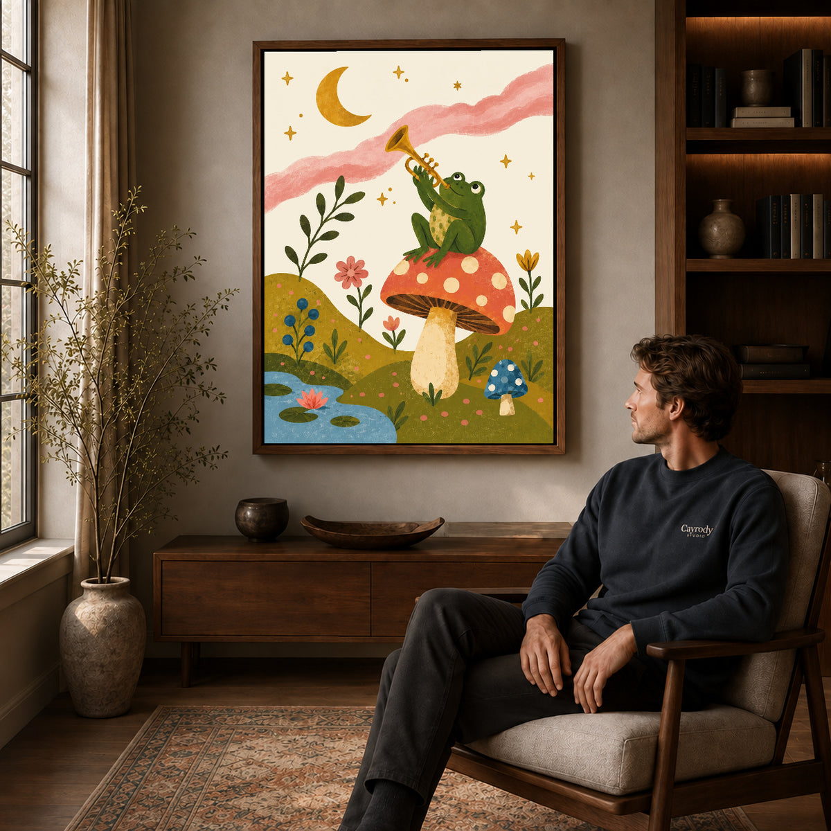 Walnut framed trumpet mushroom frog canvas art displayed above a seated man in a wood furnished room.