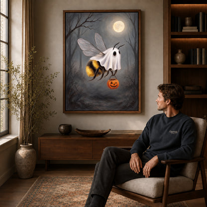 Walnut framed ghost costume bee canvas art displayed above a seated man in a wood furnished room.