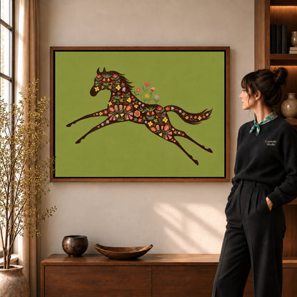 Floral Galloping Horse artwork in a walnut frame beside a standing woman in a warm room.