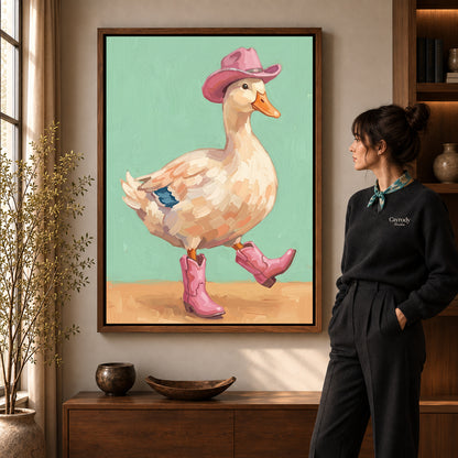 Cowboy boots duck canvas art in a walnut frame beside a standing woman in a warm living room.