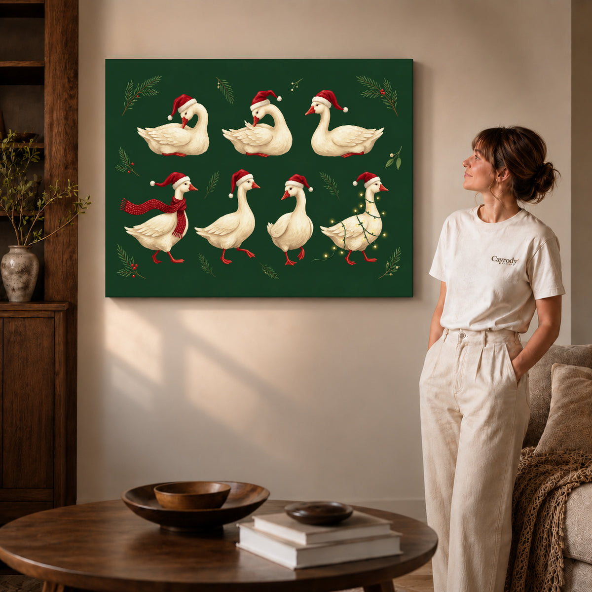 Gallery wrapped holiday goose flock canvas art with naturally shaded canvas edges beside a woman wearing cream clothing.