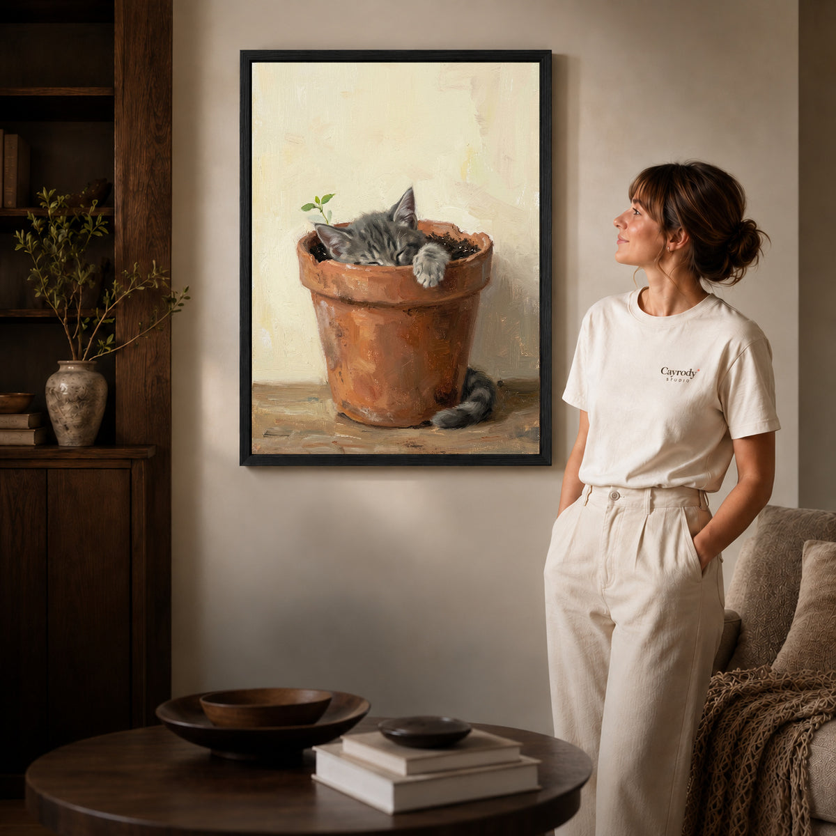 Black framed sleeping kitten pot canvas art room scene assigned to all six black framed canvas sizes.