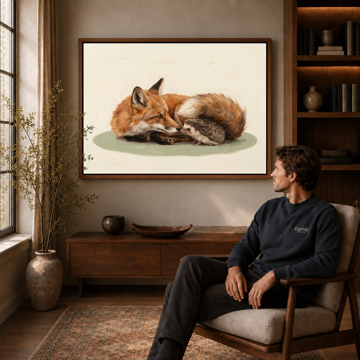 Walnut framed fox hedgehog friends canvas art displayed above a seated man in a wood furnished room.