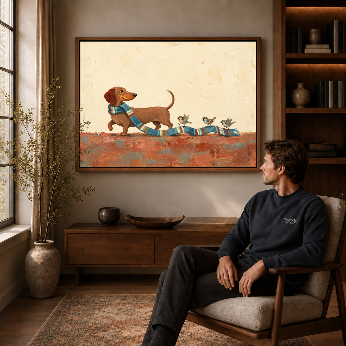 Walnut framed scarf bird parade artwork above a seated man in a wood furnished living room.