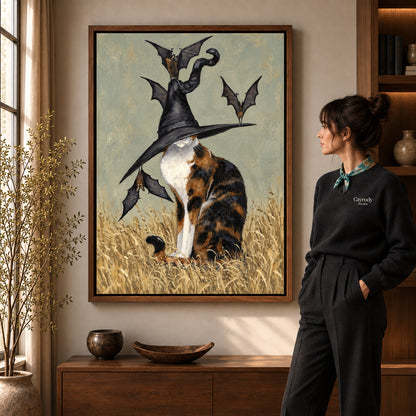 Calico Witch Hat artwork in a walnut frame beside a standing woman in a warm room.