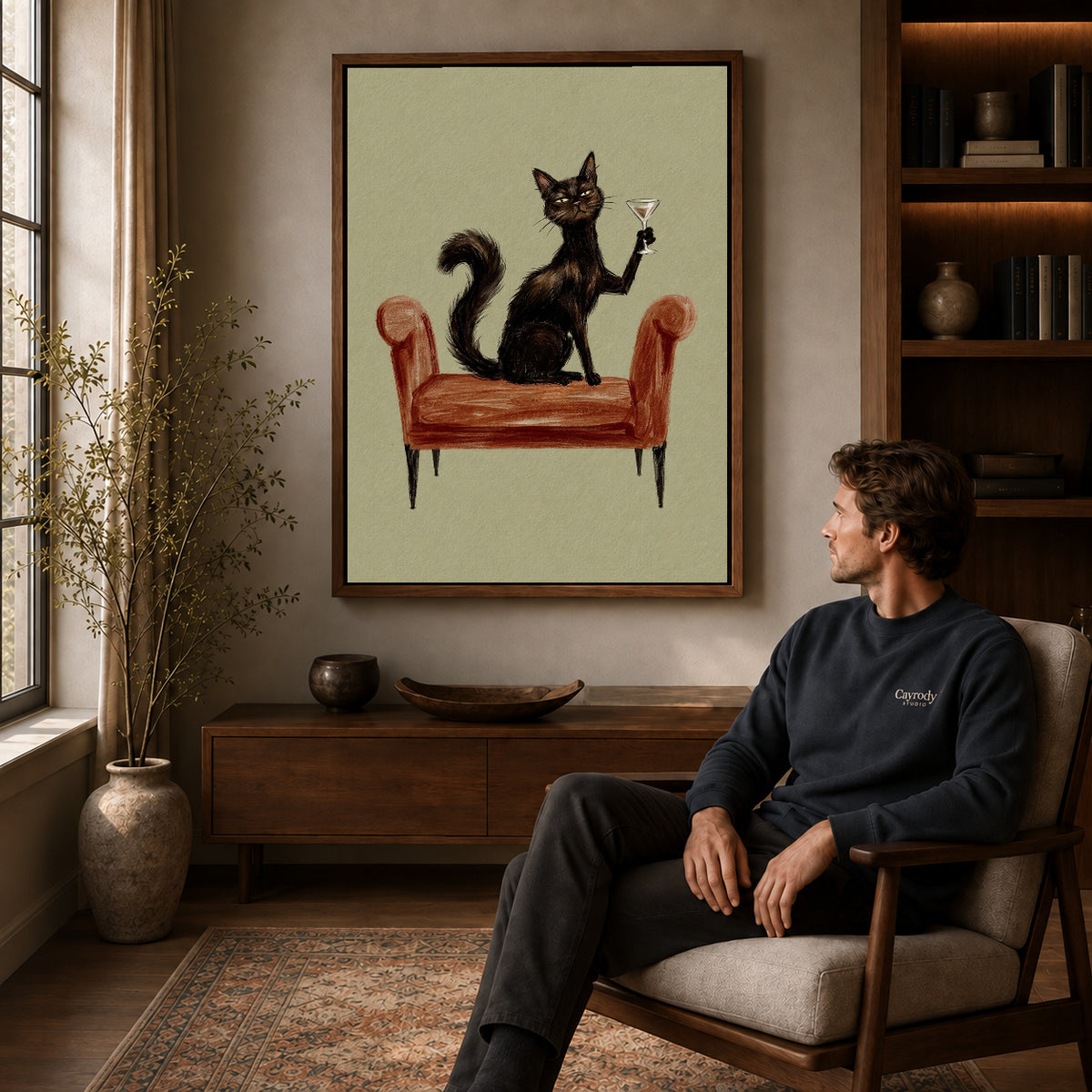 Walnut framed armchair cocktail cat artwork above a seated man in a wood furnished living room.
