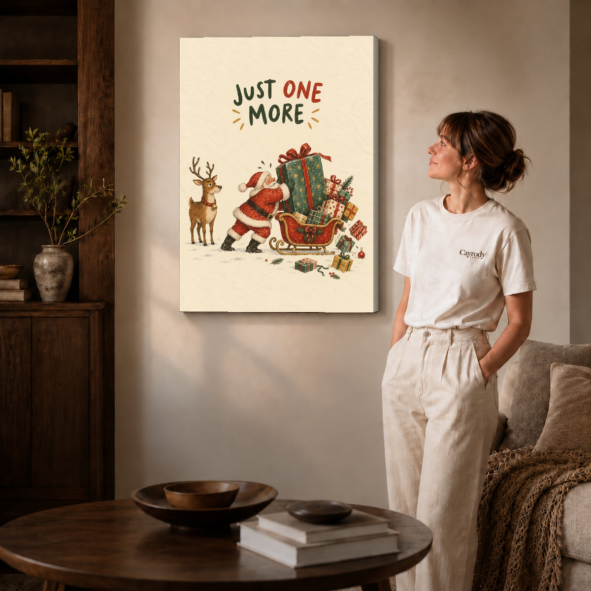 Gallery wrapped one more gift artwork with shaded canvas edges beside a woman wearing cream clothing.
