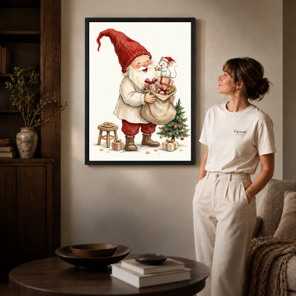 Black framed santa mouse surprise artwork beside a woman in a warm neutral living room.