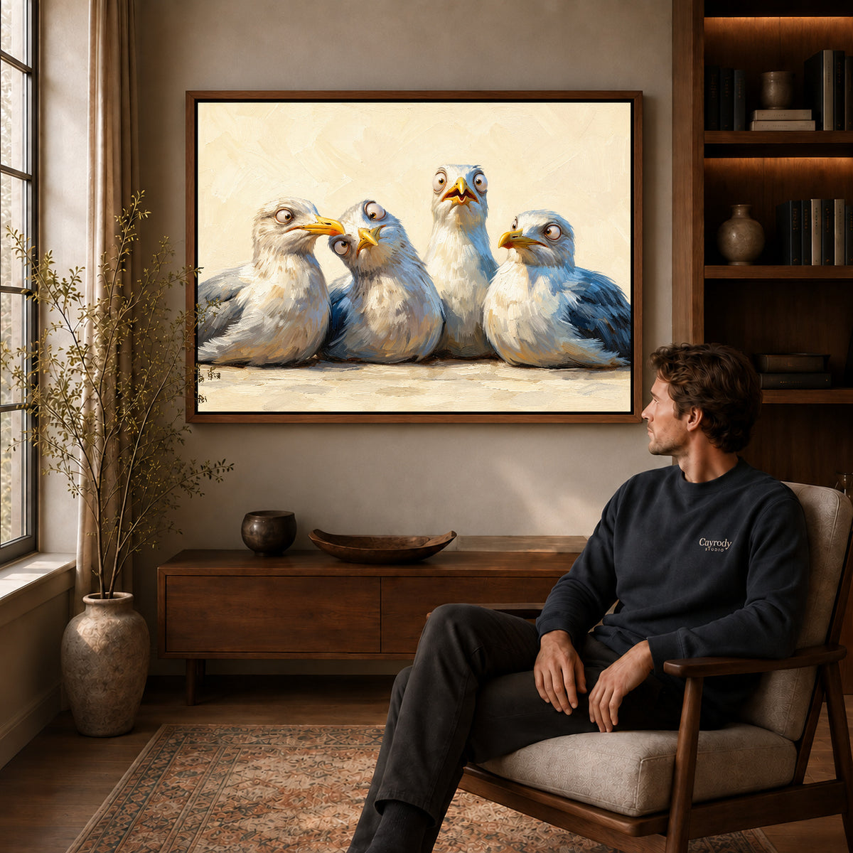 Walnut framed quirky seagull quartet artwork above a seated man in a wood furnished living room.