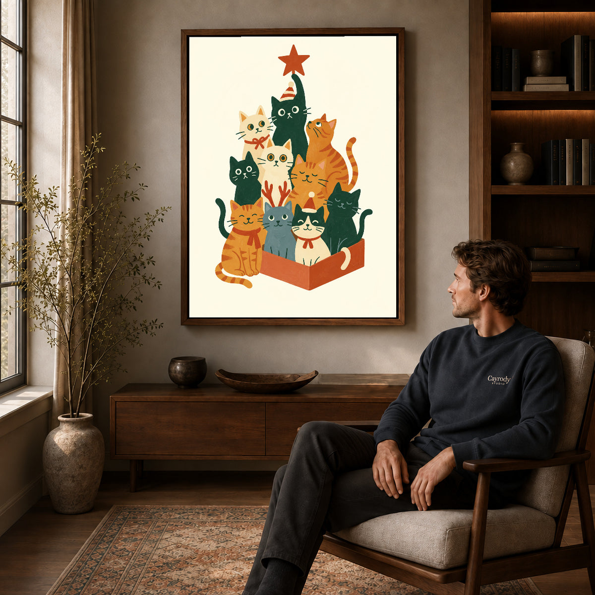 Walnut framed christmas cat gathering artwork above a seated man in a wood furnished living room.