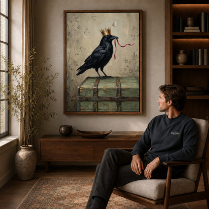 Walnut framed crowned raven ribbon canvas art displayed above a seated man in a wood furnished room.