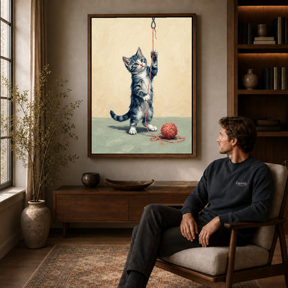Walnut framed playful yarn kitten artwork above a seated man in a wood furnished living room.