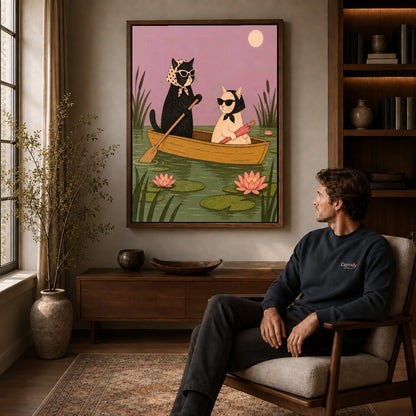 Walnut framed boat cat friends artwork above a seated man in a wood furnished living room.