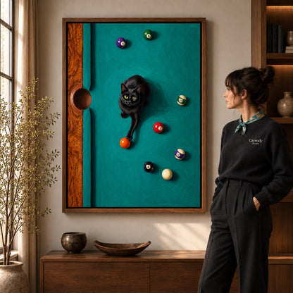 Playful Billiard Cat artwork in a walnut frame beside a standing woman in a warm room.