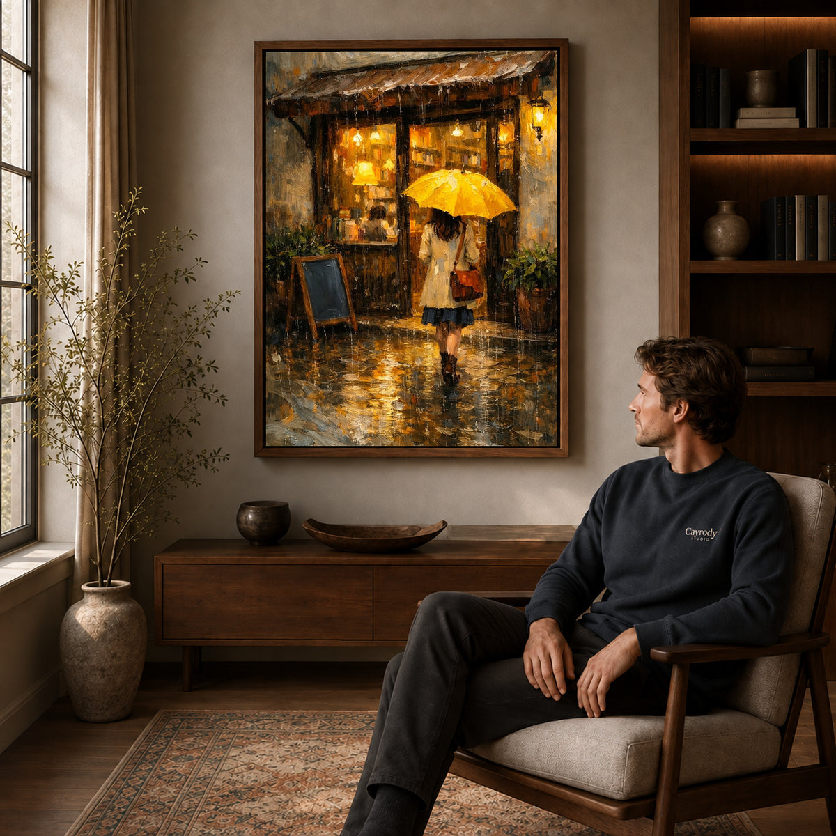 Walnut framed rainy cafe walk artwork above a seated man in a wood furnished living room.