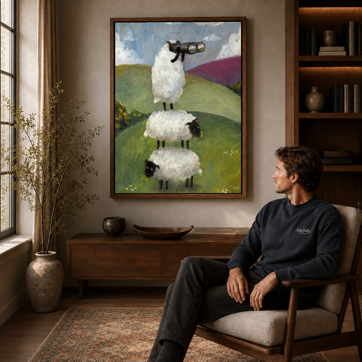 Walnut framed curious sheep stack artwork above a seated man in a wood furnished living room.