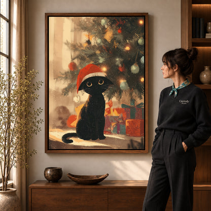 Cozy Christmas Cat artwork in a walnut frame beside a standing woman in a warm room.
