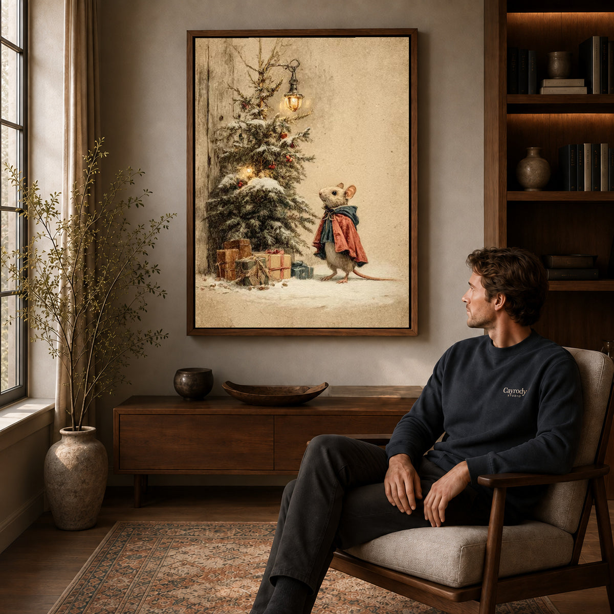 Walnut framed christmas mouse visit artwork above a seated man in a wood furnished living room.