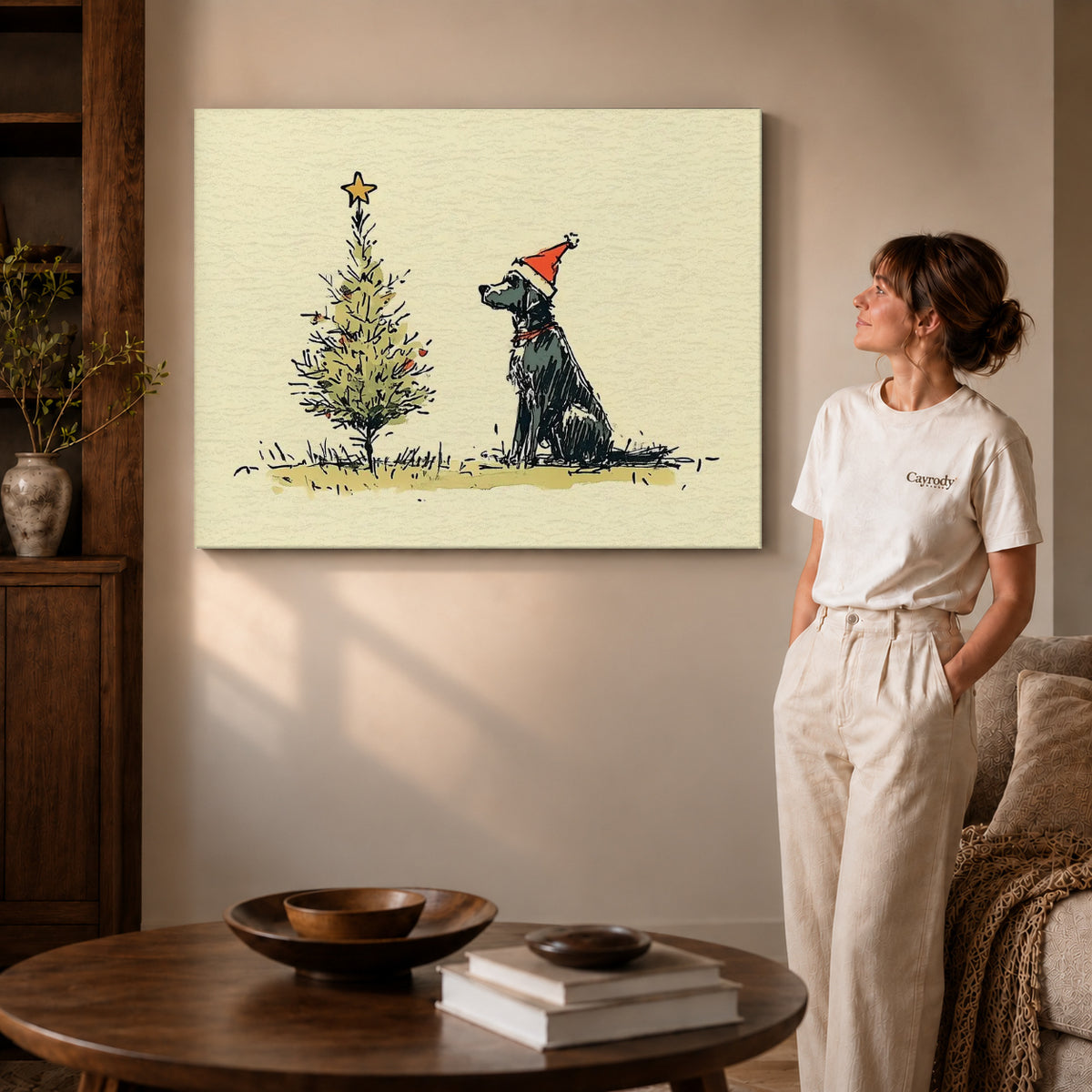 Gallery wrapped christmas dog sketch artwork with shaded canvas edges beside a woman wearing cream clothing.