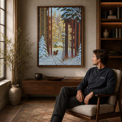 Walnut framed snowy forest sleigh artwork above a seated man in a wood furnished living room.