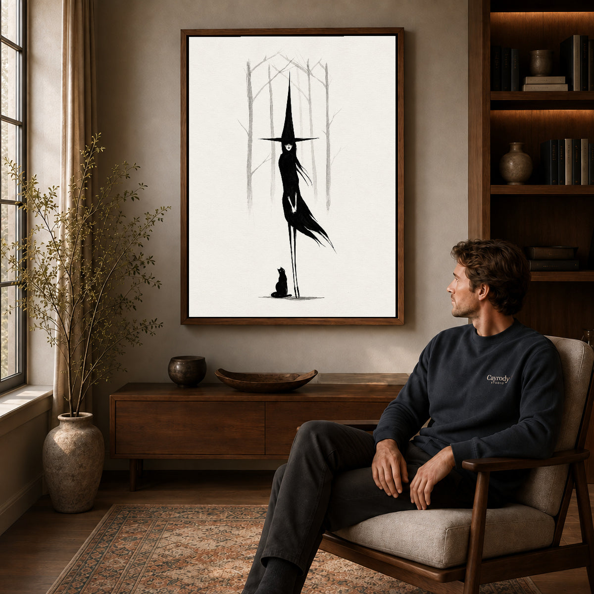 Walnut framed tall witch companion artwork above a seated man in a wood furnished living room.