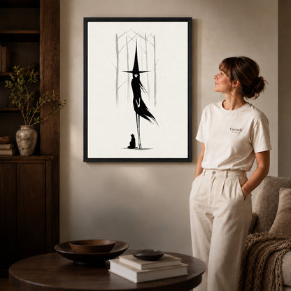 Black framed tall witch companion artwork beside a woman in a warm neutral living room.