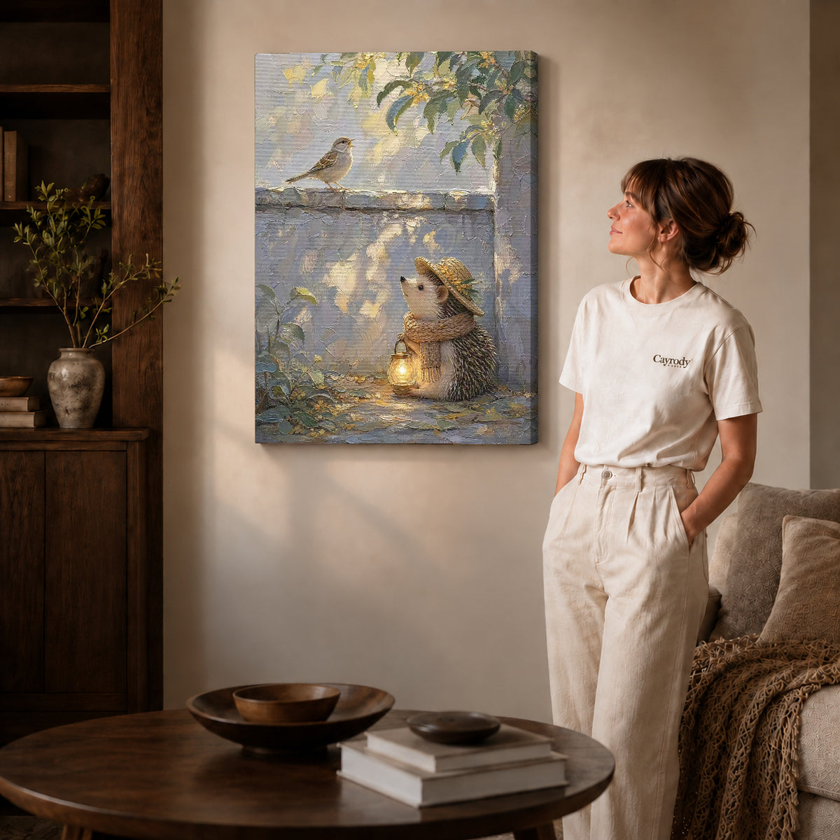 Gallery wrapped hedgehog lantern walk artwork with shaded canvas edges beside a woman wearing cream clothing.