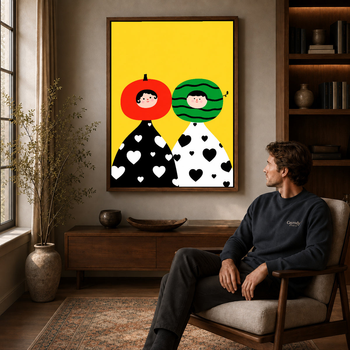 Walnut framed fruit head couple artwork above a seated man in a wood furnished living room.