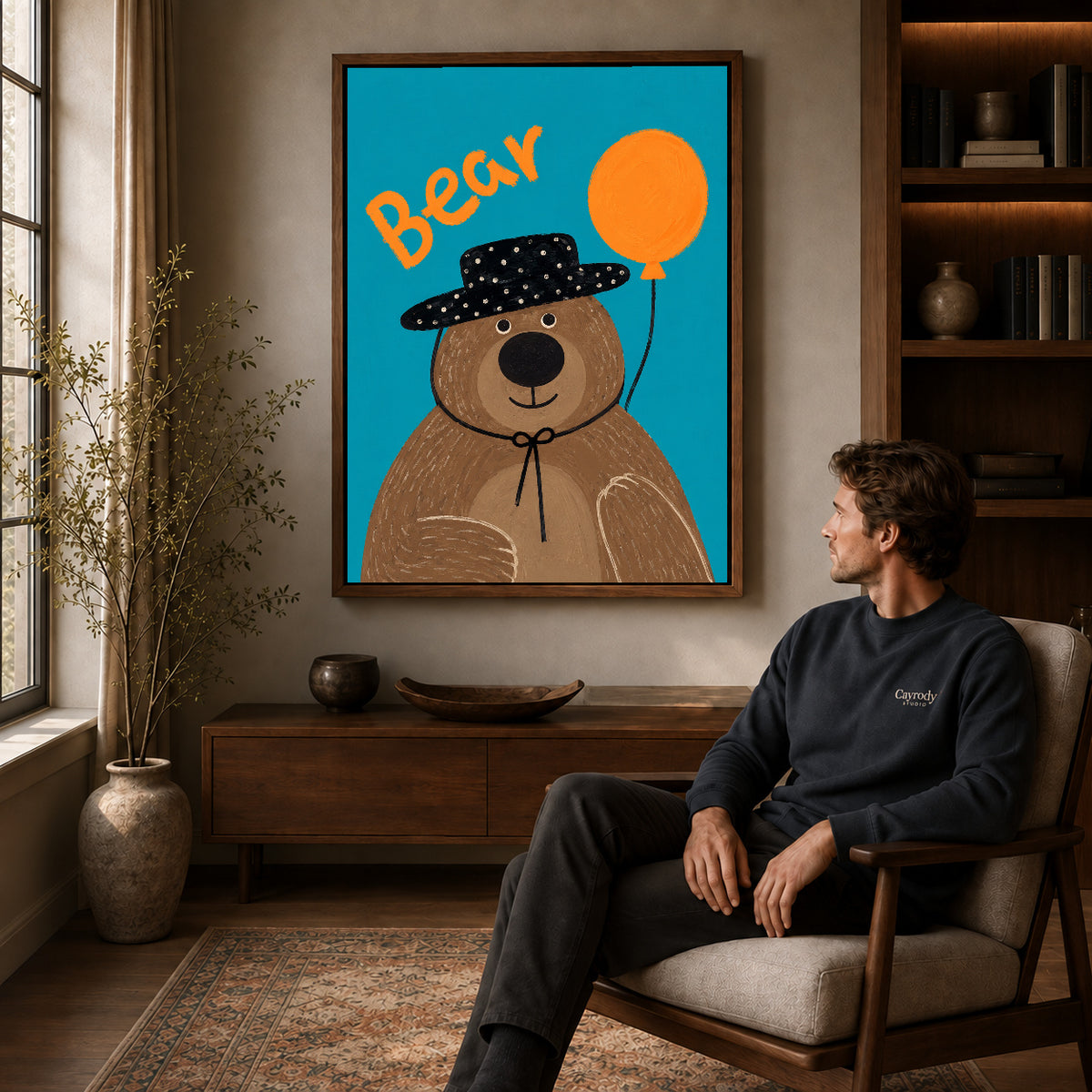 Walnut framed balloon bear portrait artwork above a seated man in a wood furnished living room.