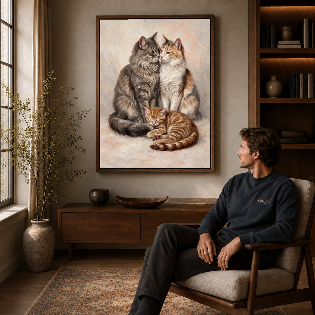 Walnut framed gentle cat family artwork above a seated man in a wood furnished living room.