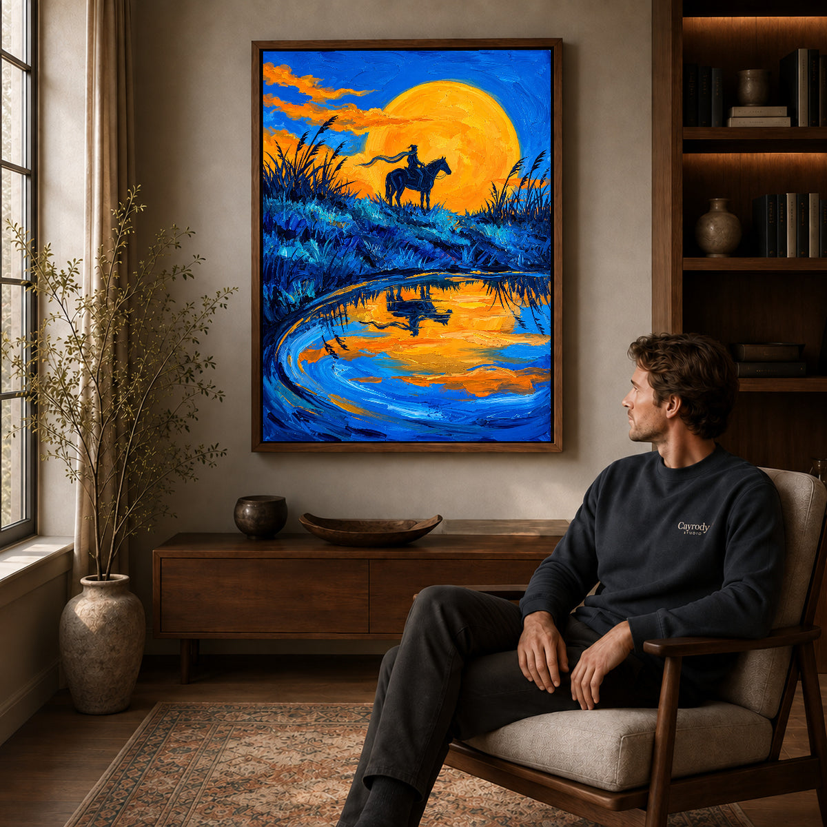 Walnut framed golden moon rider artwork above a seated man in a wood furnished living room.