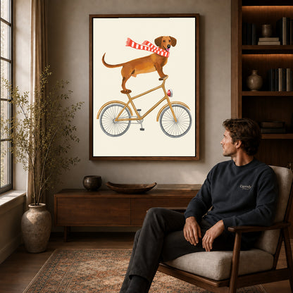 Walnut framed bicycle dachshund artwork above a seated man in a wood furnished living room.