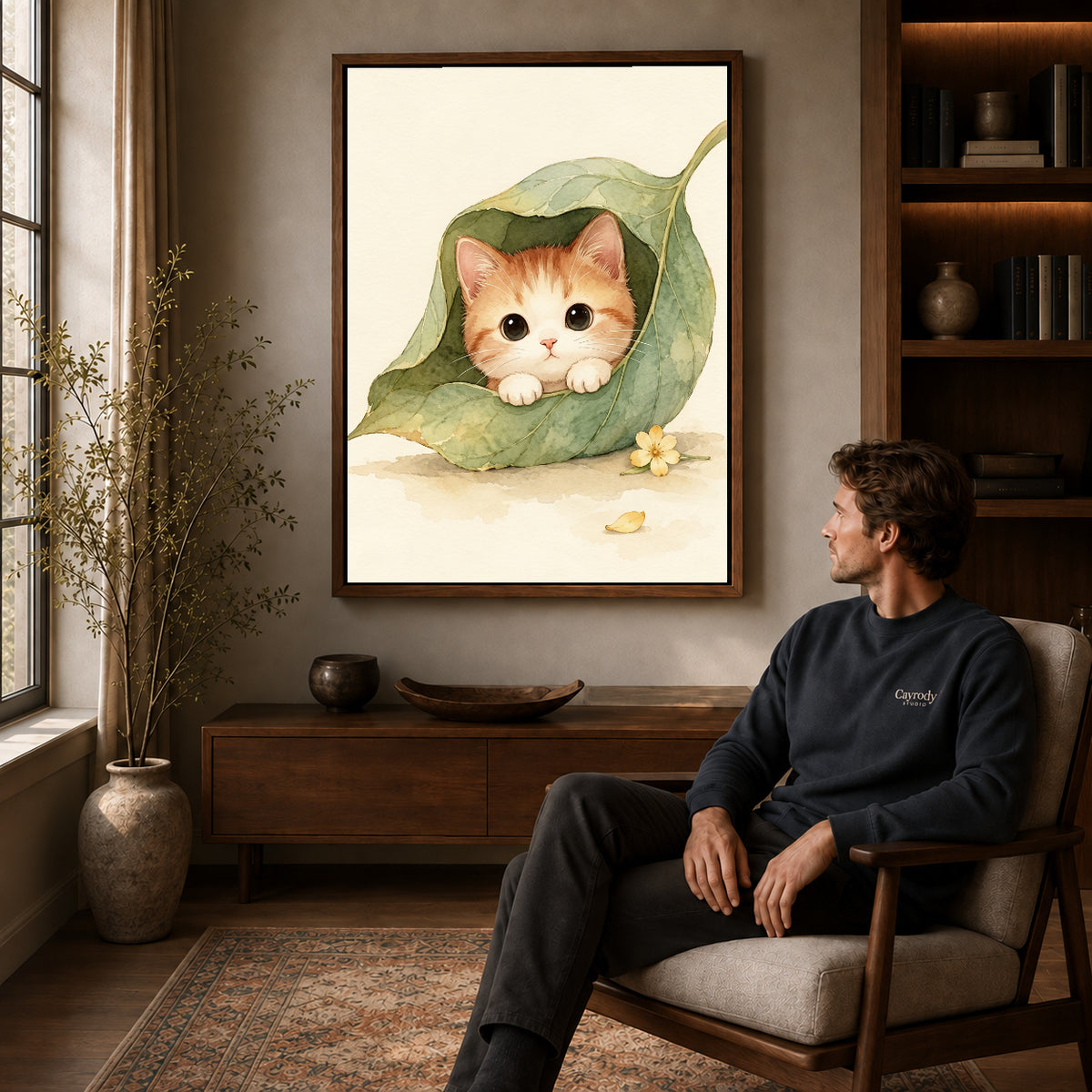 Walnut framed leaf pocket kitten artwork above a seated man in a wood furnished living room.