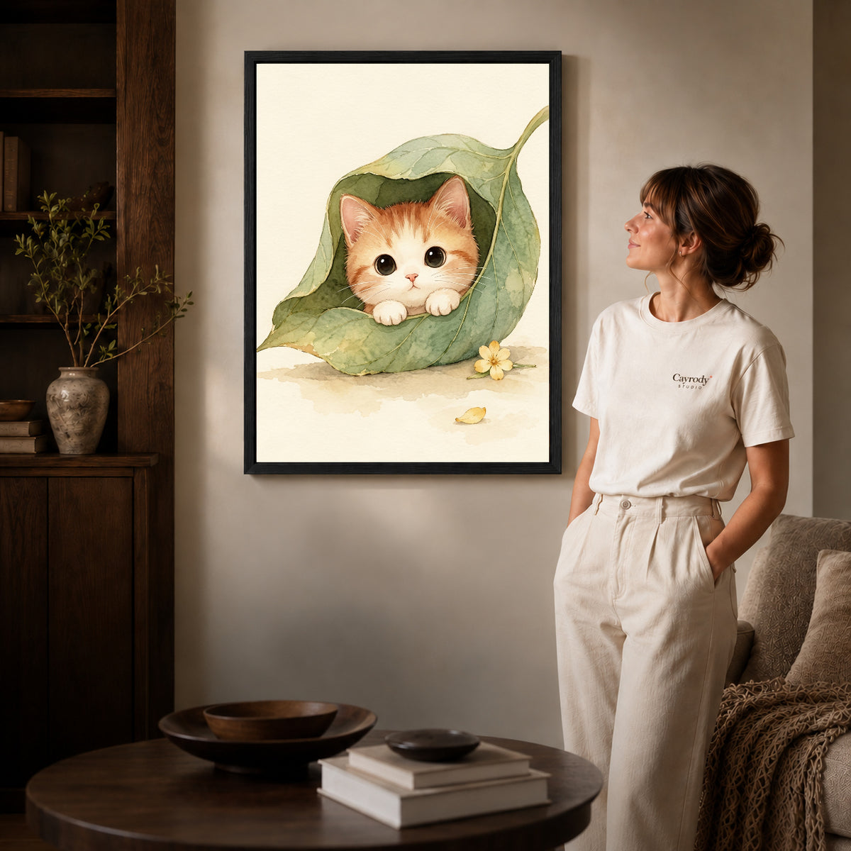 Black framed leaf pocket kitten artwork scene assigned to all six black framed canvas sizes.