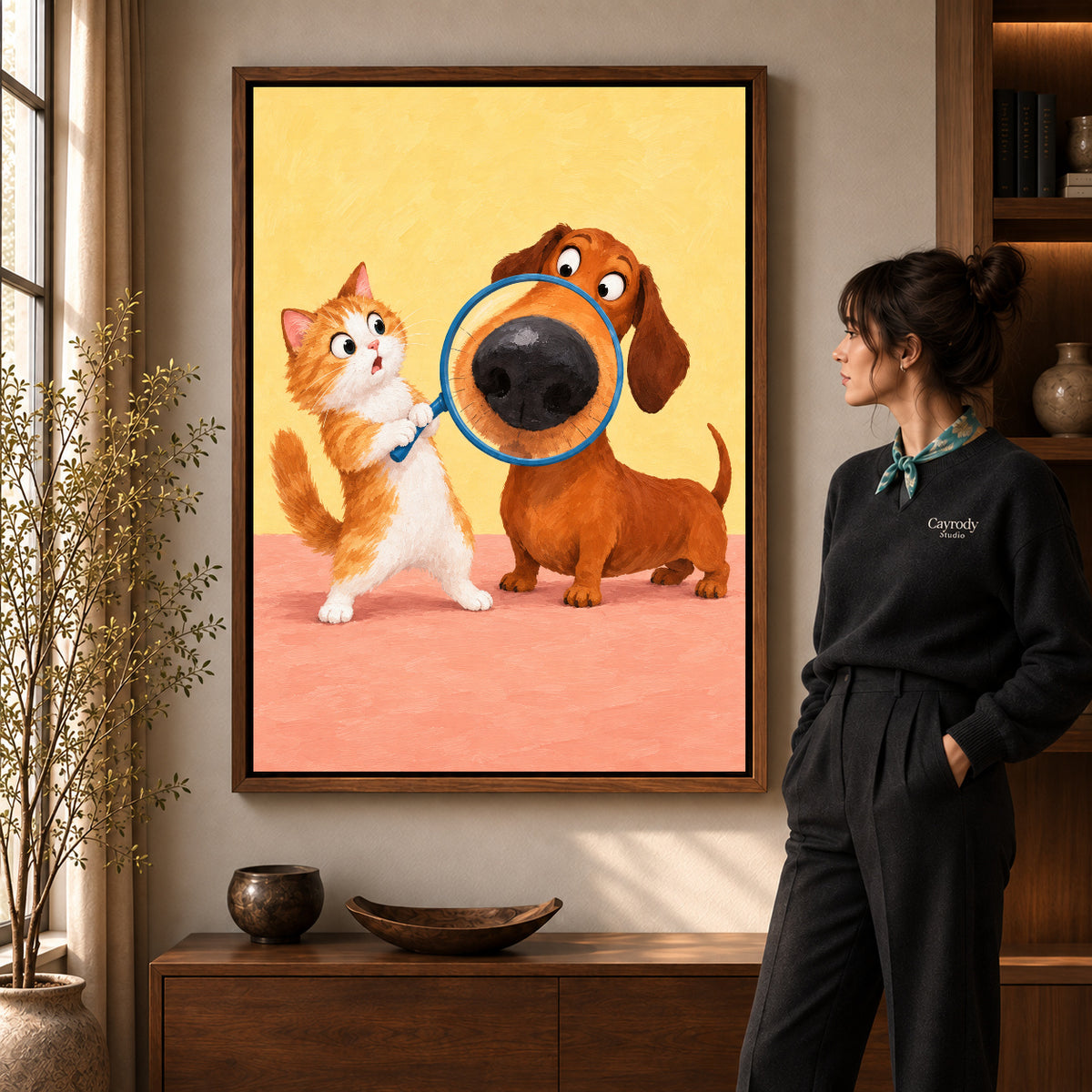 Magnifying Puppy Nose artwork in a walnut frame beside a standing woman in a warm room.