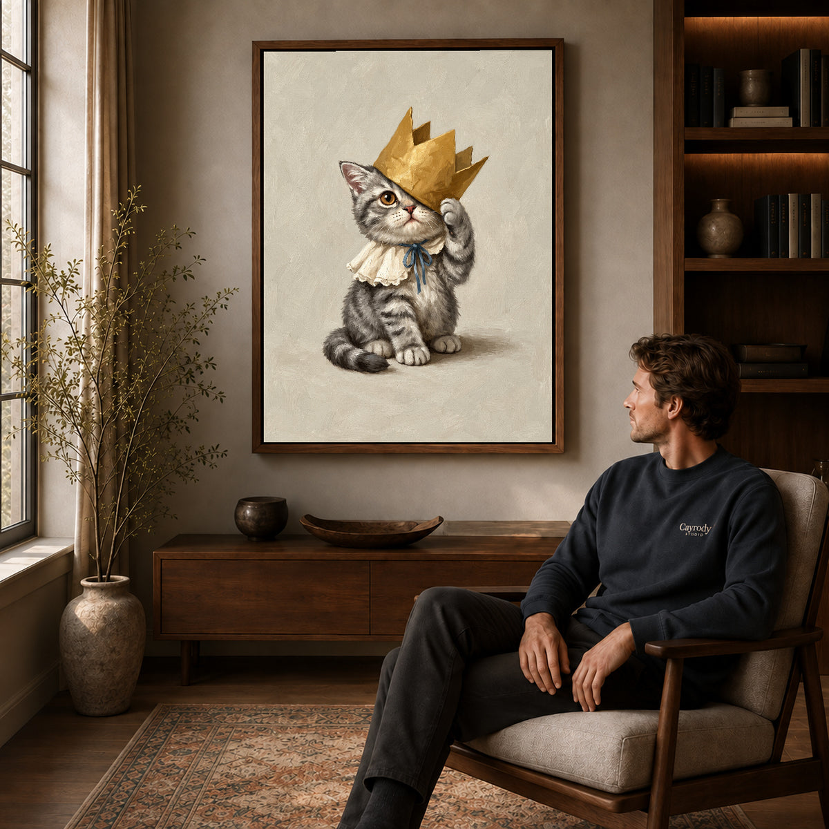 Walnut framed golden crown kitten artwork above a seated man in a wood furnished living room.