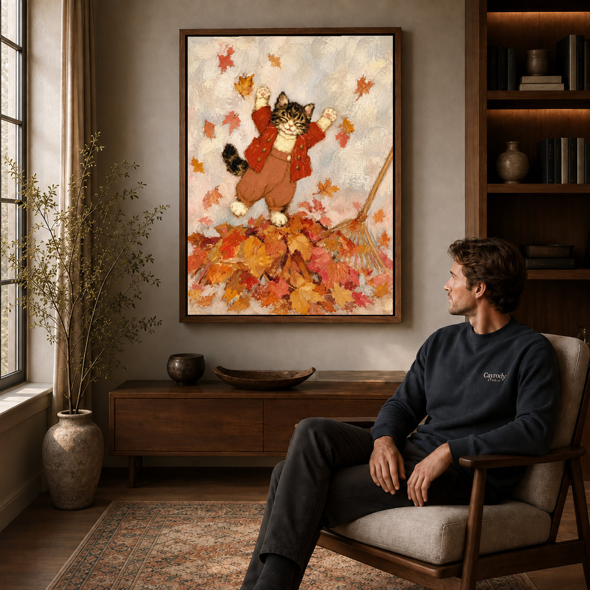 Walnut framed autumn leaf kitten artwork above a seated man in a wood furnished living room.
