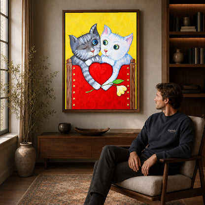 Walnut framed heart holding kittens artwork above a seated man in a wood furnished living room.