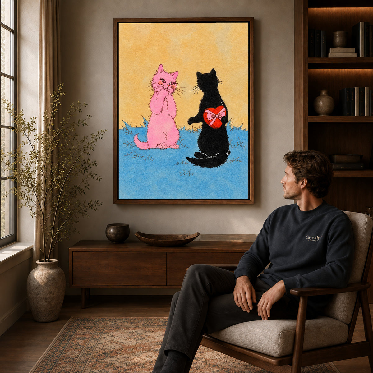 Walnut framed hidden heart cat artwork above a seated man in a wood furnished living room.