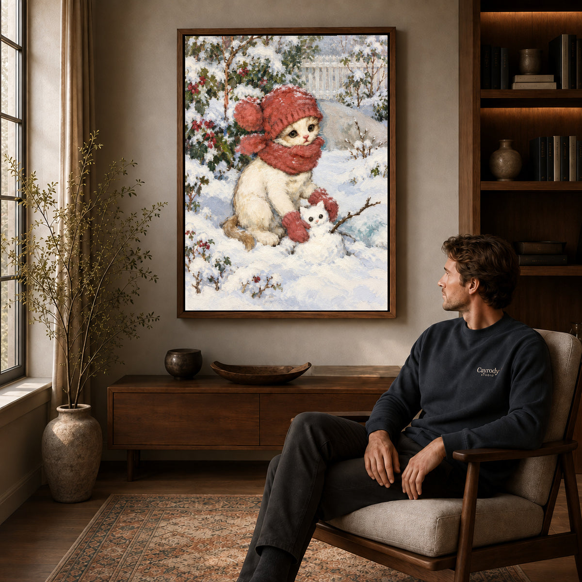 Walnut framed snowman kitten friend artwork above a seated man in a wood furnished living room.