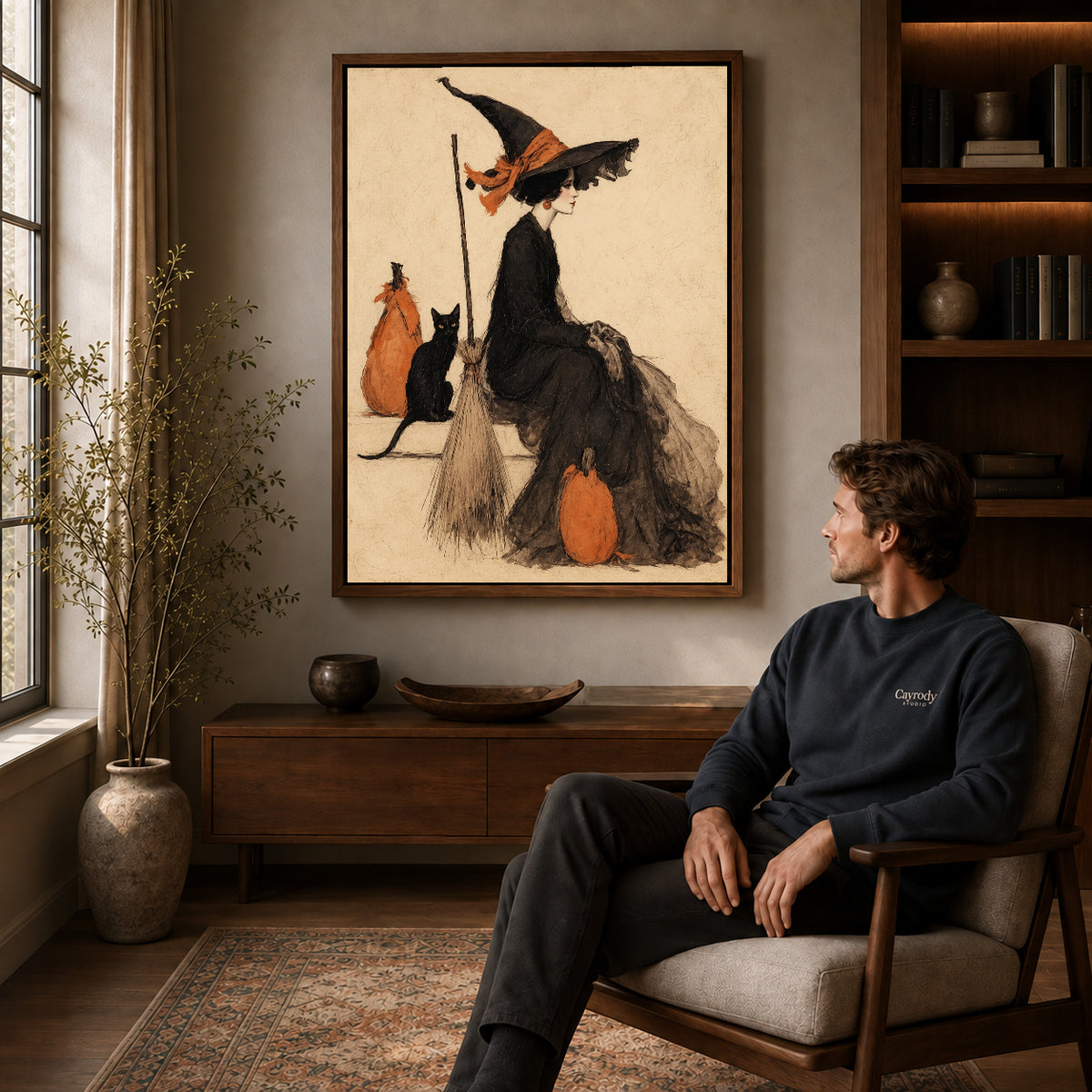 Walnut framed elegant witch companion artwork above a seated man in a wood furnished living room.