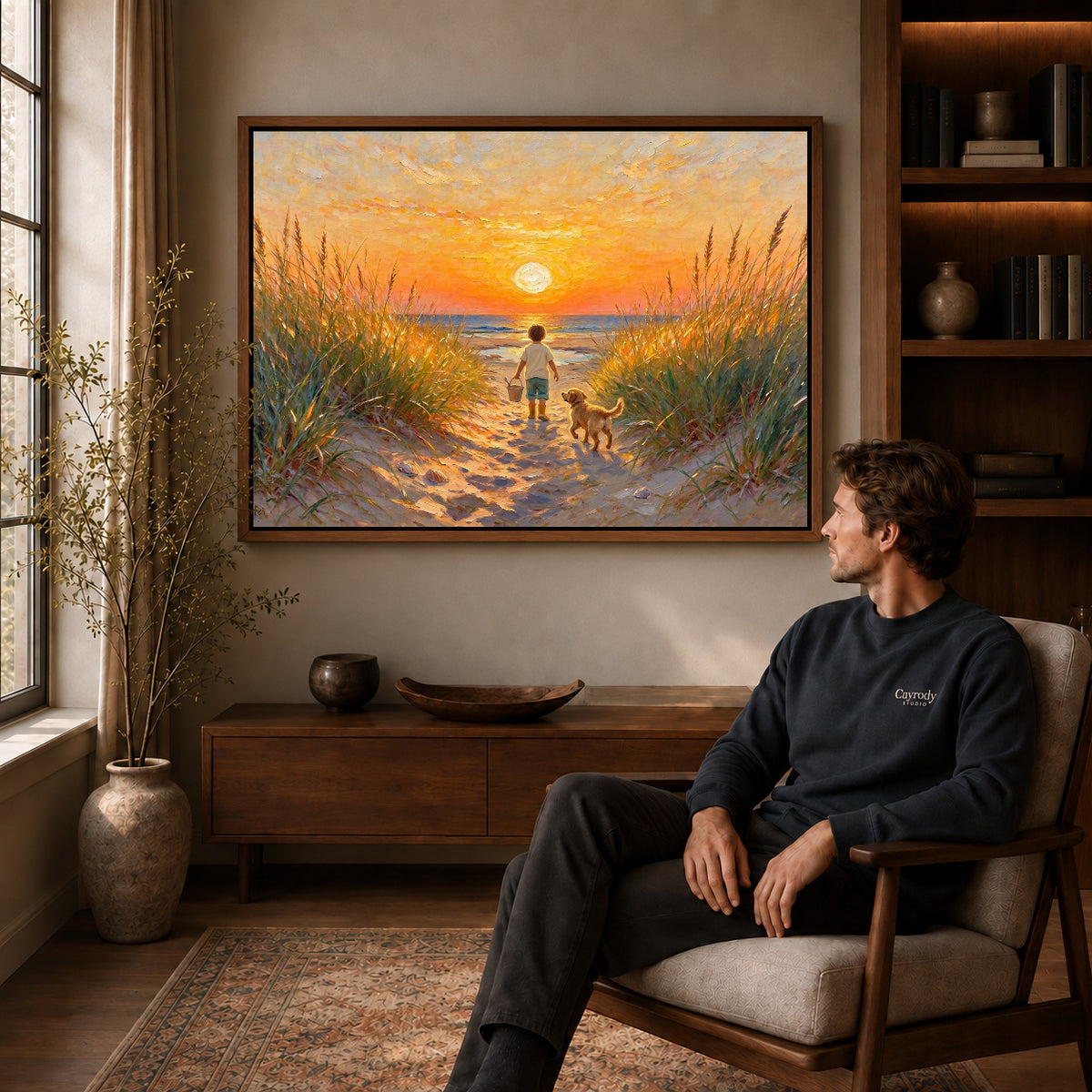 Walnut framed sunset beach companions artwork above a seated man in a wood furnished living room.