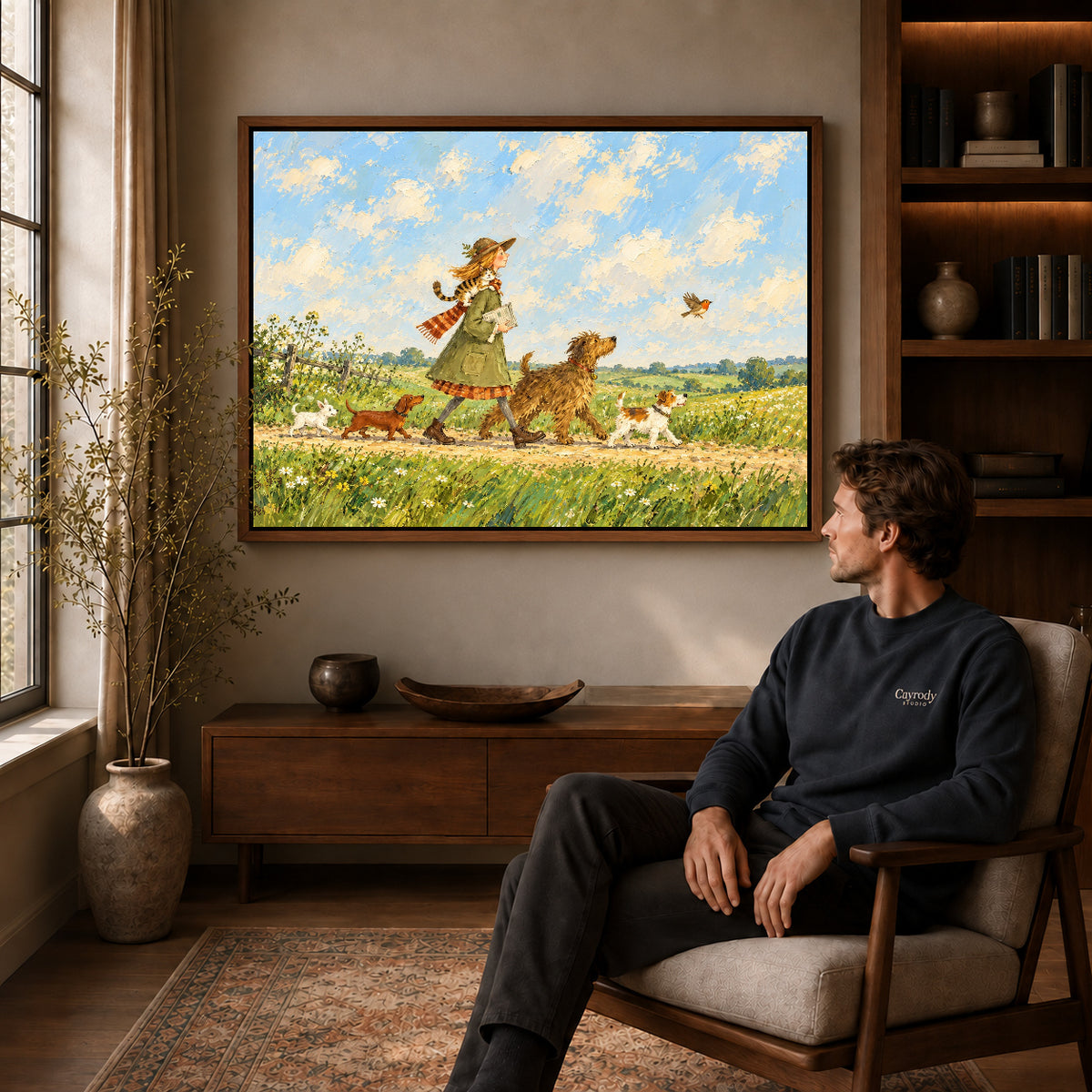 Walnut framed countryside dog walk artwork above a seated man in a wood furnished living room.