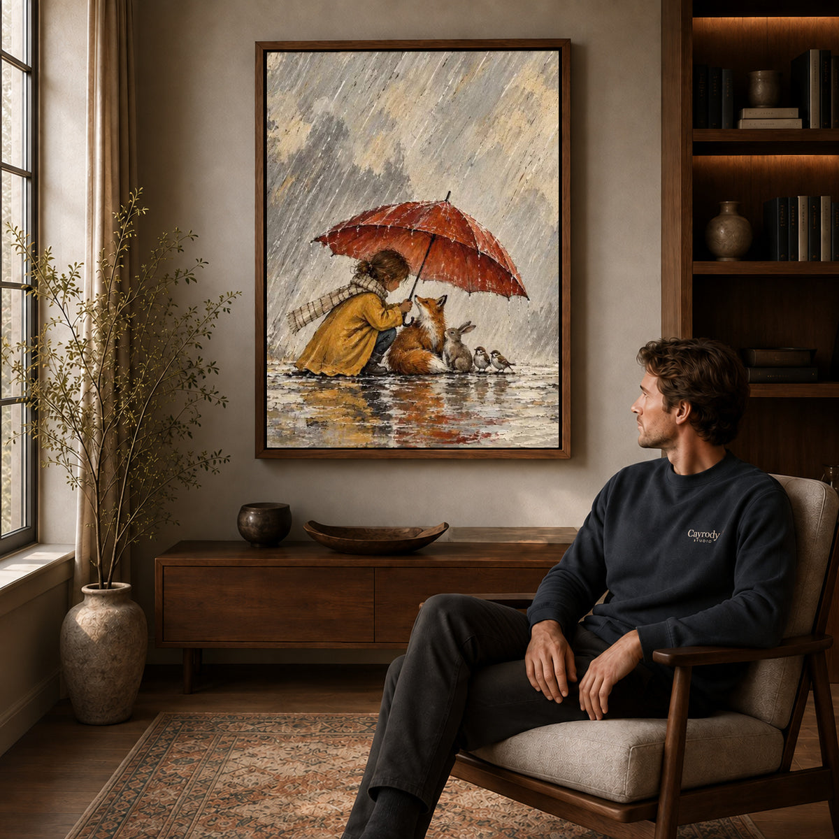 Walnut framed rainy woodland shelter artwork above a seated man in a wood furnished living room.
