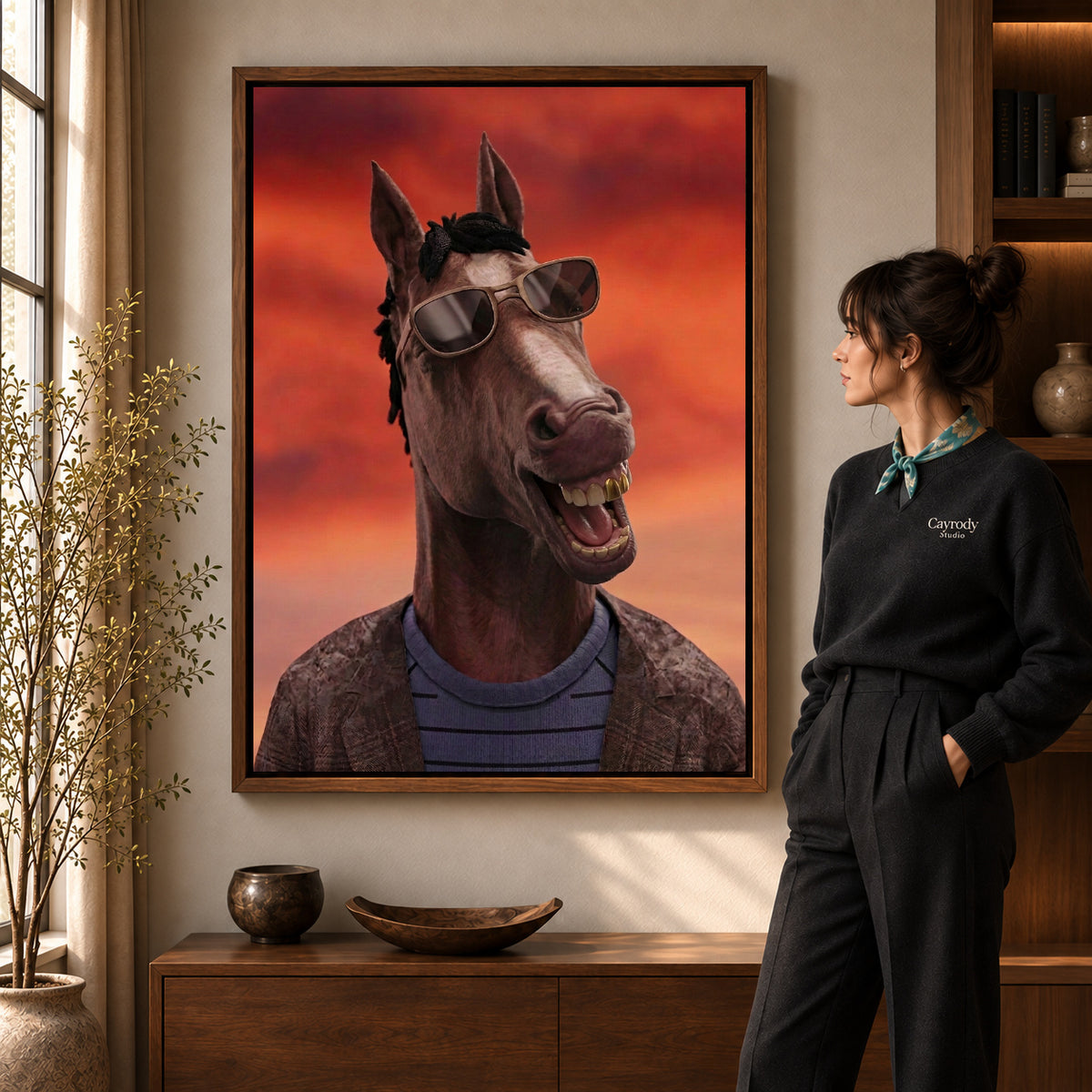 Smiling Shades Horse artwork in a walnut frame beside a standing woman in a warm room.