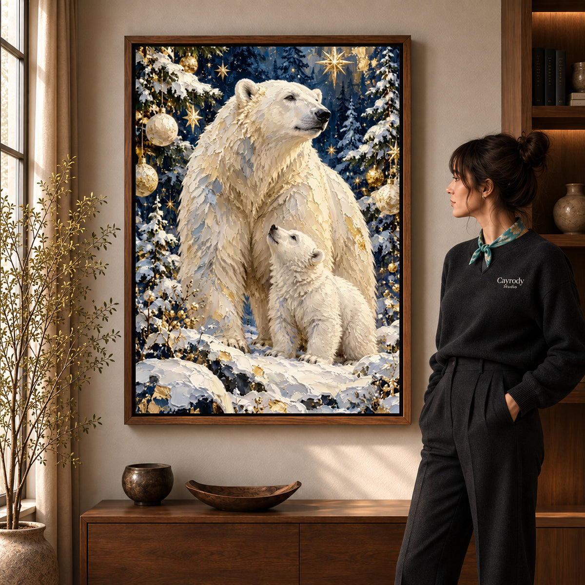 Festive Polar Bear Family artwork in a walnut frame beside a standing woman in a warm room.