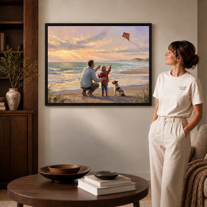 Black framed family beach kite artwork beside a woman in a warm neutral living room.