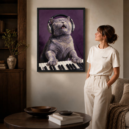 Black framed singing keyboard cat artwork beside a woman in a warm neutral living room.