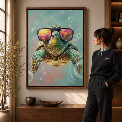 Sunglasses Sea Turtle artwork in a walnut frame beside a standing woman in a warm room.